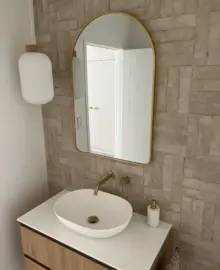 A brand new bathroom with sink and wall-mounted faucet