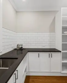 A pristine new kitchen benchtop and sink